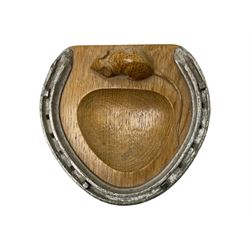 Mouseman - oak horseshoe ashtray, rounded triangular form with mounted horseshoe, carved with mouse signature, by the workshop of Robert Thompson, Kilburn, L13cm