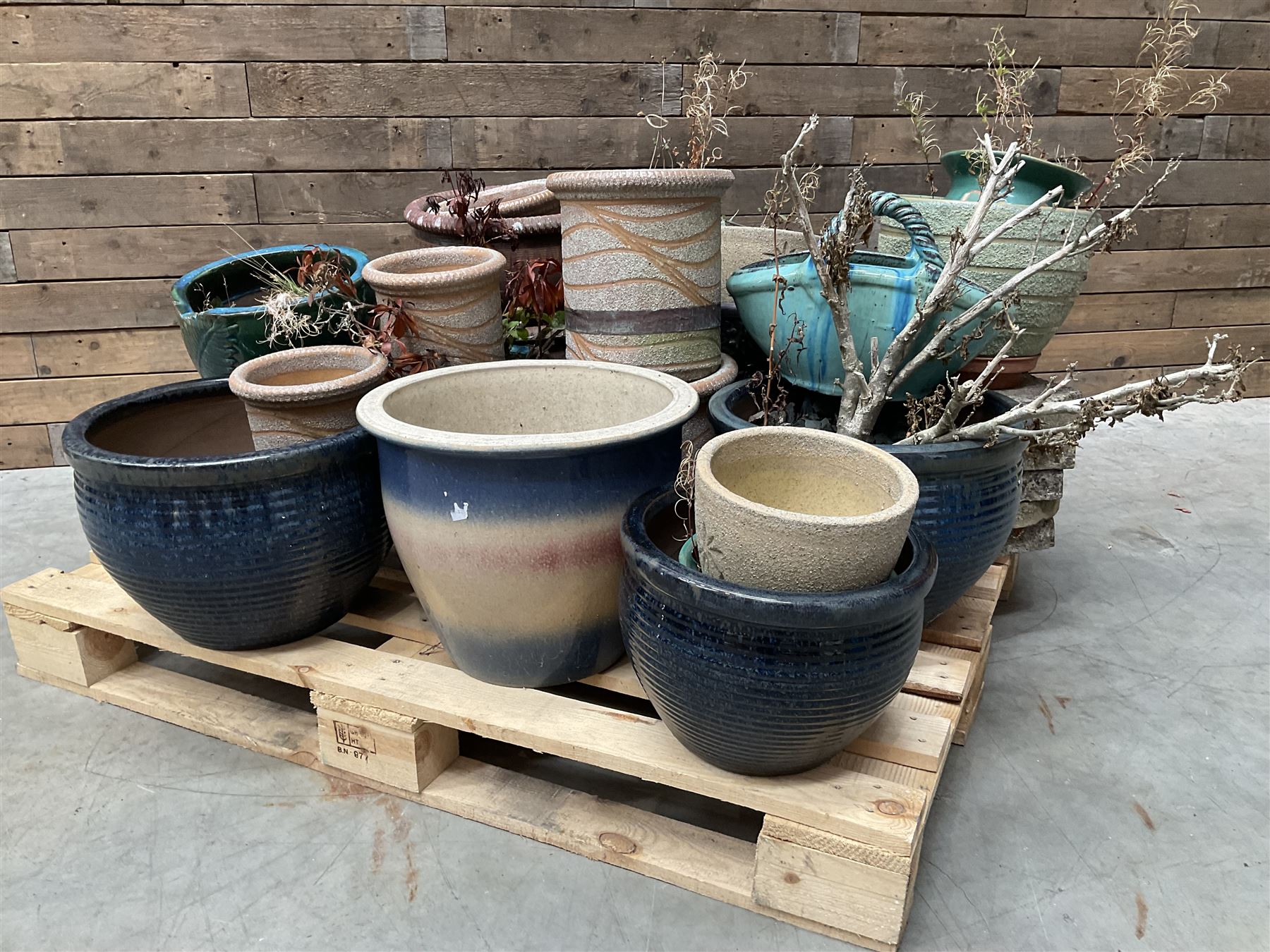 Large collection of ceramic plant pots and paving slabs, (26)