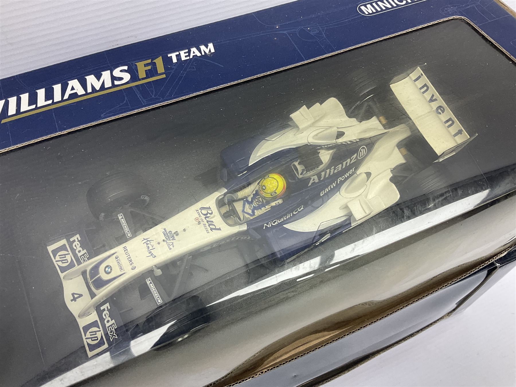 Four Minichamps 1:18 scale die-cast racing cars - Williams F1 Team BMW FW26 R. Schumacher; McLaren Mercedes MP4-12 D. Coulthard; McLaren Mercedes MP4-13 M. Hakkinen; and Formel 1 Jordan peugeot EJR 195 E. Irvine; all boxed (4)