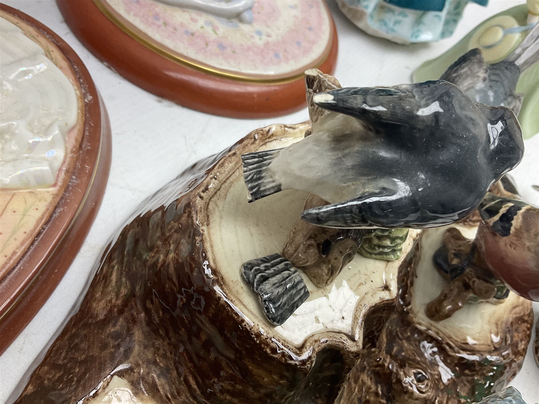 Nine Beswick bird figures, with stand, together with USSR thrush, two Franklin Mint Jane Austin figures and four Royal Doulton figures 