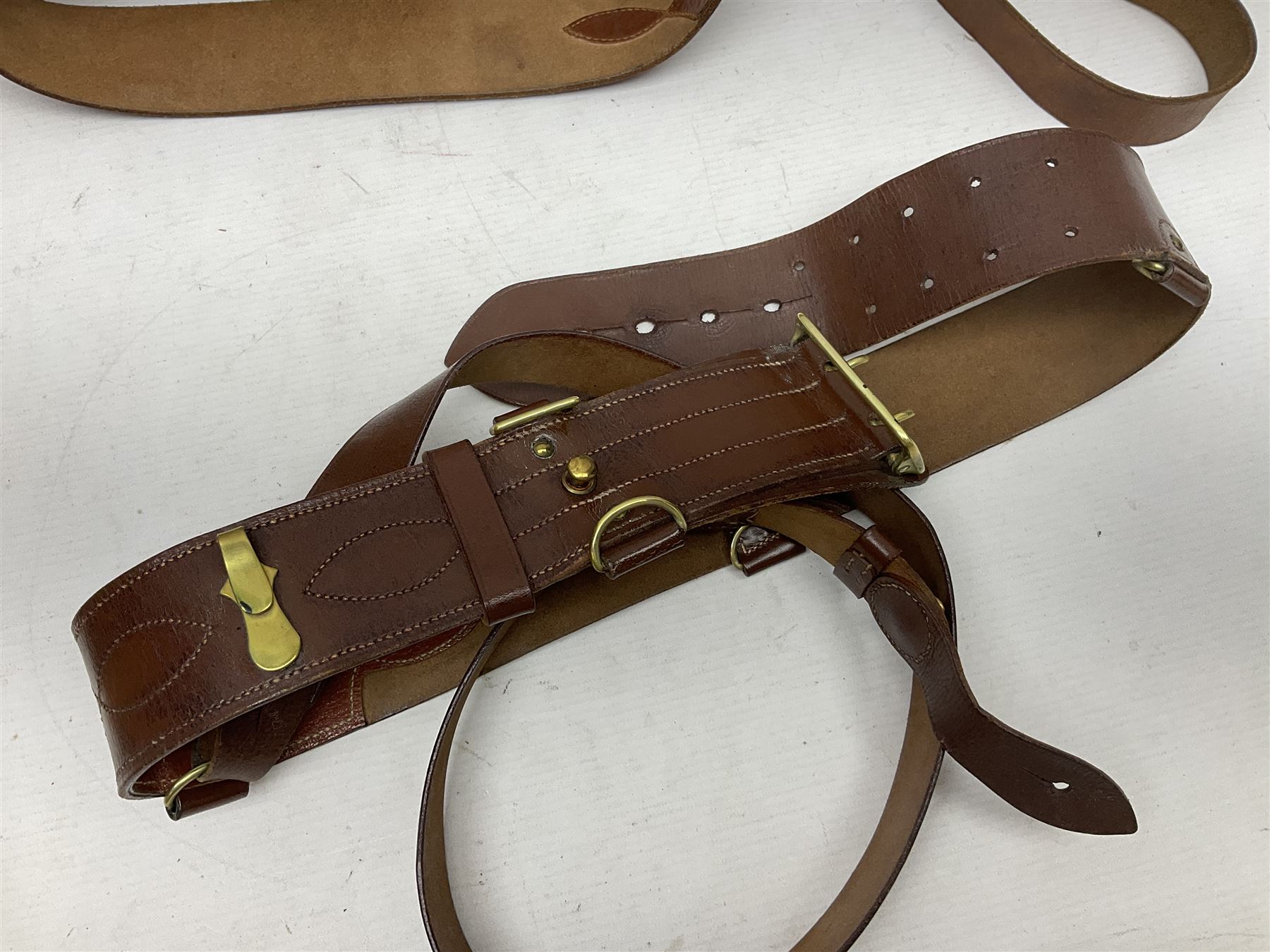 British Army General Staff officer's peaked cap by Herbert Johnson London in Moss Bros. delivery box; two officer's Sam Browne leather belts; leather pistol holster and sword hanger; pair of leather gloves and pair of spurs