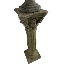 Classical design cast stone female bust depicting Artemis, raised on fluted Corinthian column with acanthus leaf capital, stepped square base, looking right 