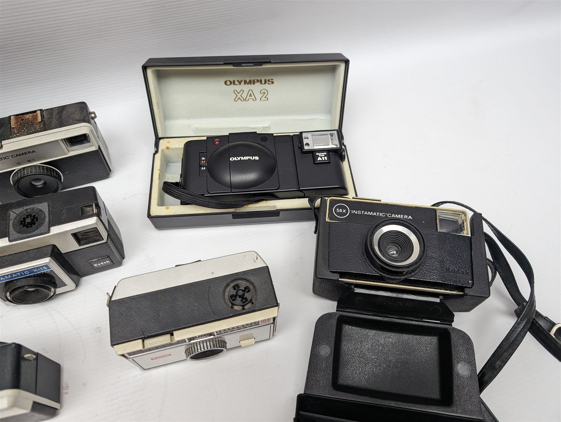 Canon EOS 650 camera, serial no 2122736, in carry case with some accessories, together with an Olympus XA2 camera and ten Kodak Instamatic cameras and two similar