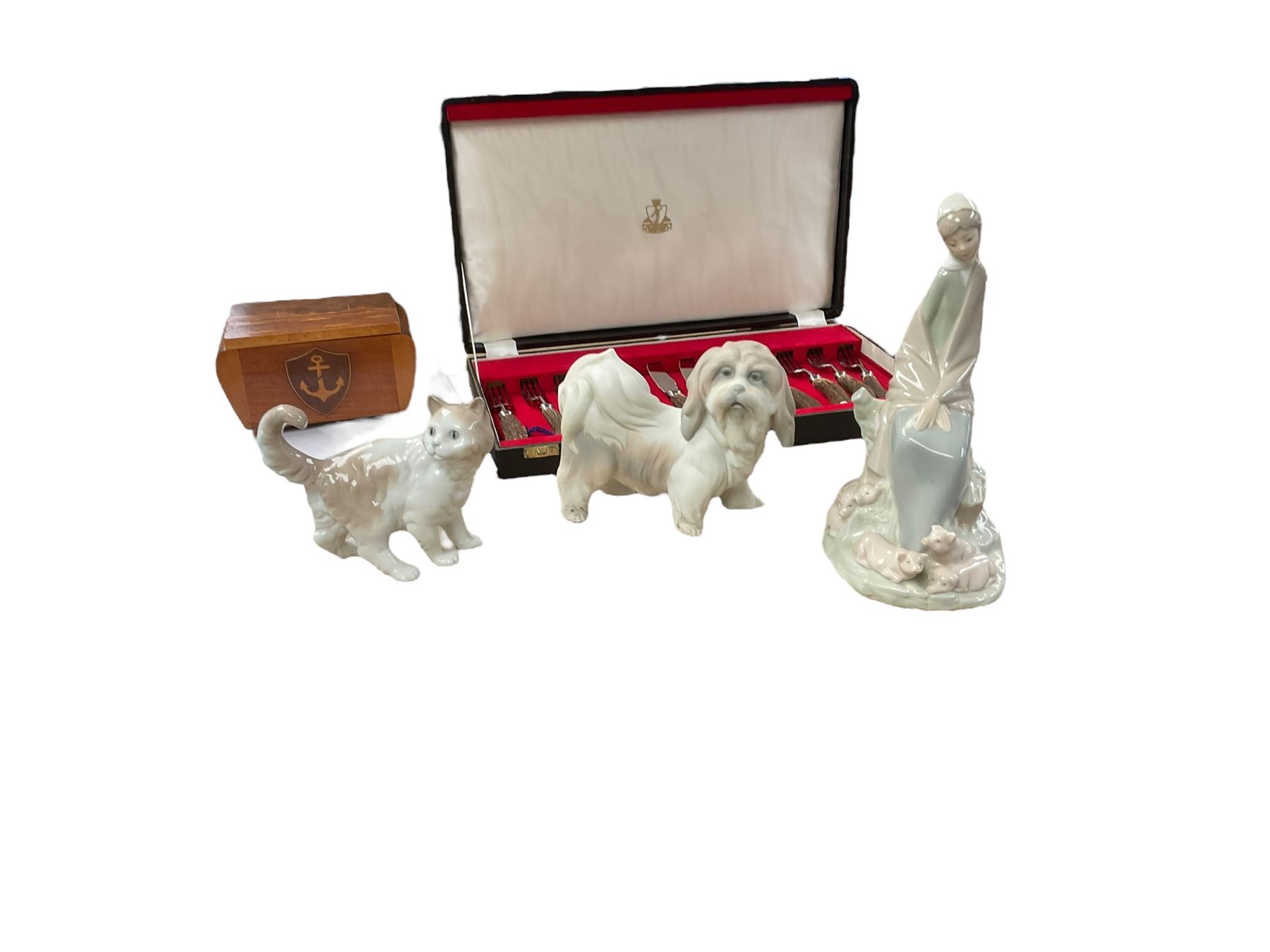 Horn handled canteen of cutlery set, together with with wooden cigarette box, two Nao figures and Lladro figure 