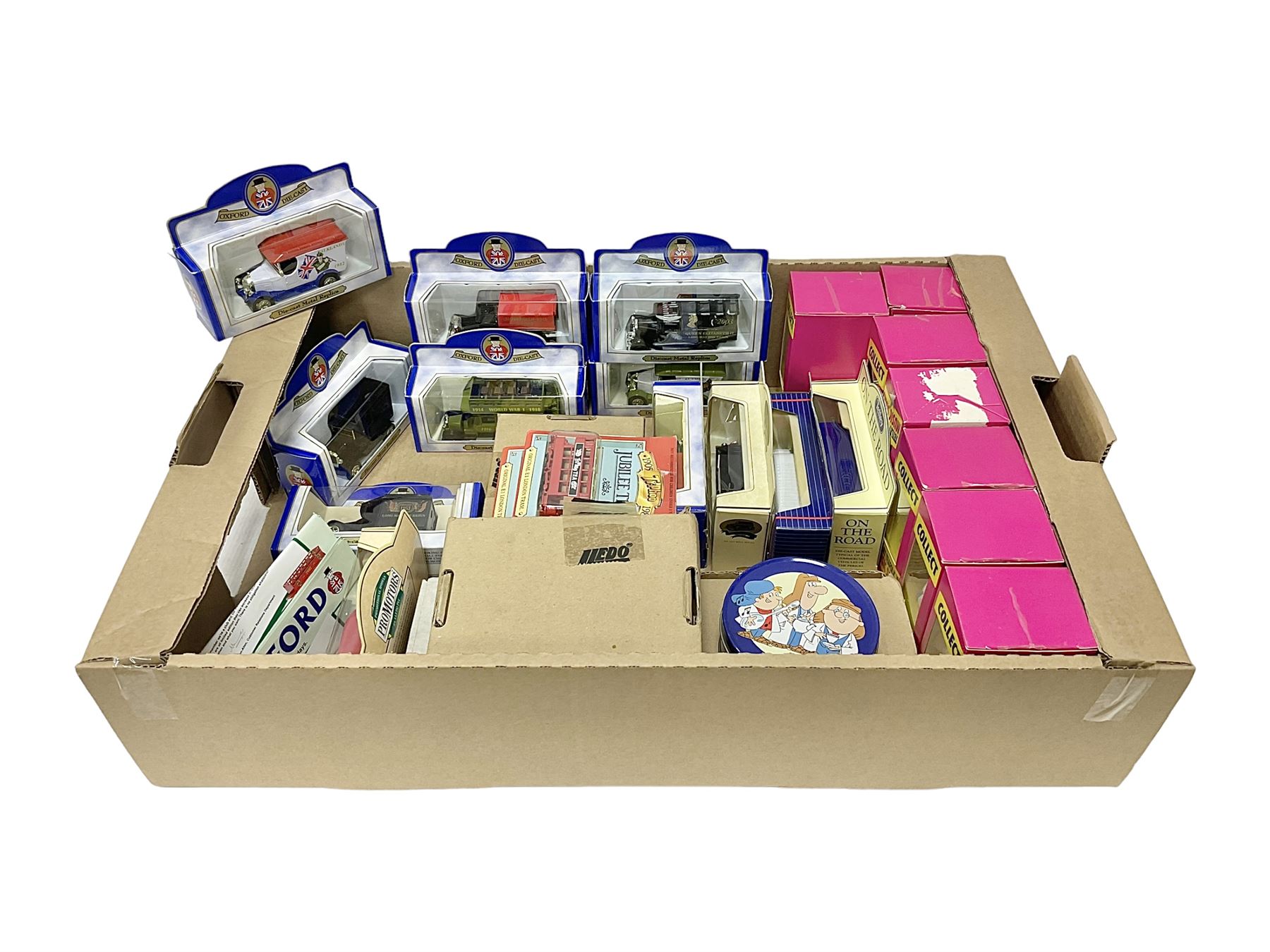 Collection of Tetley Tea collectibles to include sixteen 1:43 scale model cars from Lledo and Oxford Die-Cast with further Tetley Tea figures and tinned coaster set