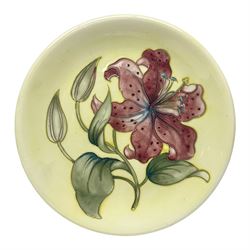 Moorcroft Tiger Lily pattern plate on a 