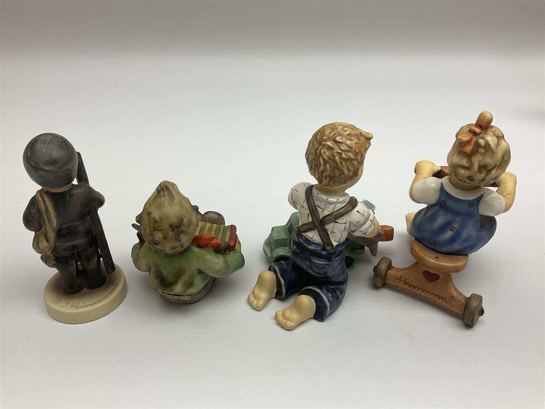 Twenty six Hummel figures by Goebel, to include Fire Fighter, Band Leader and Spring Sowing