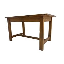Traditional waxed pine kitchen or dining table, rectangular top over square supports united by H-stretcher