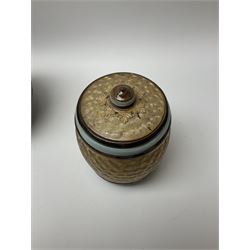 A group of Doulton Lambeth and Royal Doulton tobacco jars, to include examples with relief moulded foliate decoration, each with impressed marks and markers monograms beneath. 