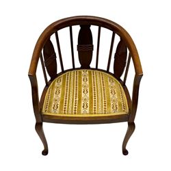 Late Victorian mahogany framed tub chair, rounded backrest with vertical splats and three carved oval medallions, upholstered seat in yellow patterned fabric, on cabriole supports