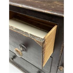 Early 19th century scumbled pine dresser, the projecting cornice over two heights plate rack with moulded frame, the base with reeded canted corners fitted with three drawers and two panelled cupboards, panelled sides, moulded skirt base