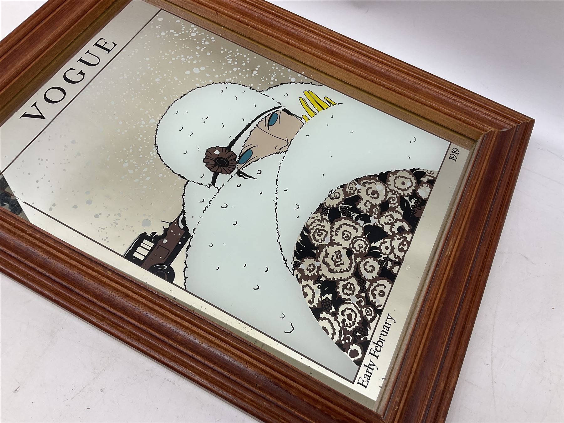Wall mirror printed with a February 1919 Vogue cover of an Art