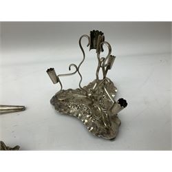 Four hallmarked silver trumpet vases, total weight 108g, upon silver plated stand with foliate decoration and bun feet