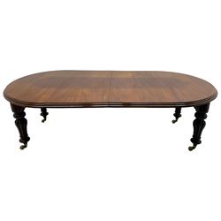 Victorian mahogany extending dining table, circular telescopic extending top with moulded edge, two additional leaves, on turned and lobe carved supports with brass and ceramic castors 