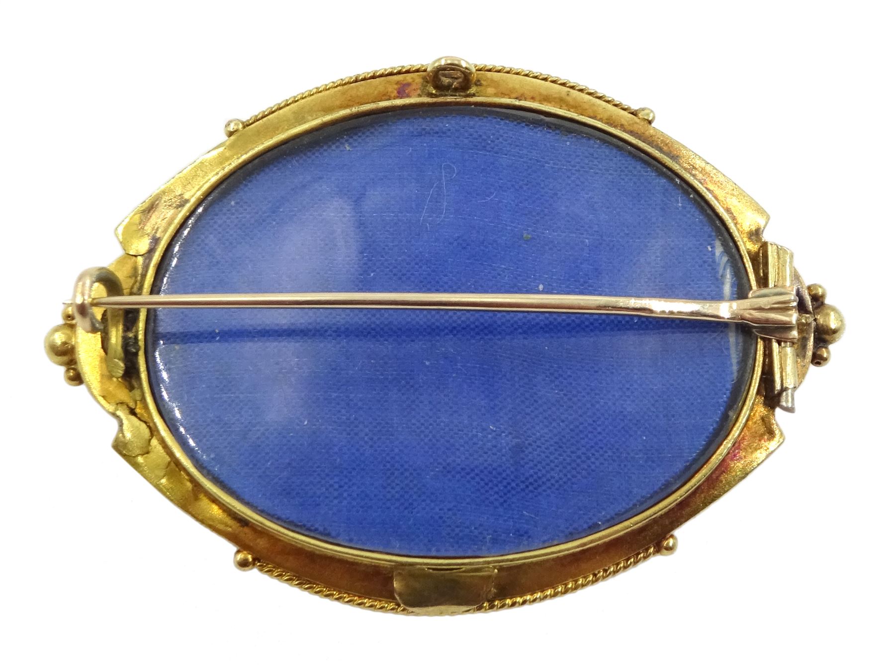 Victorian Etruscan revival gold brooch set with an oval citrine