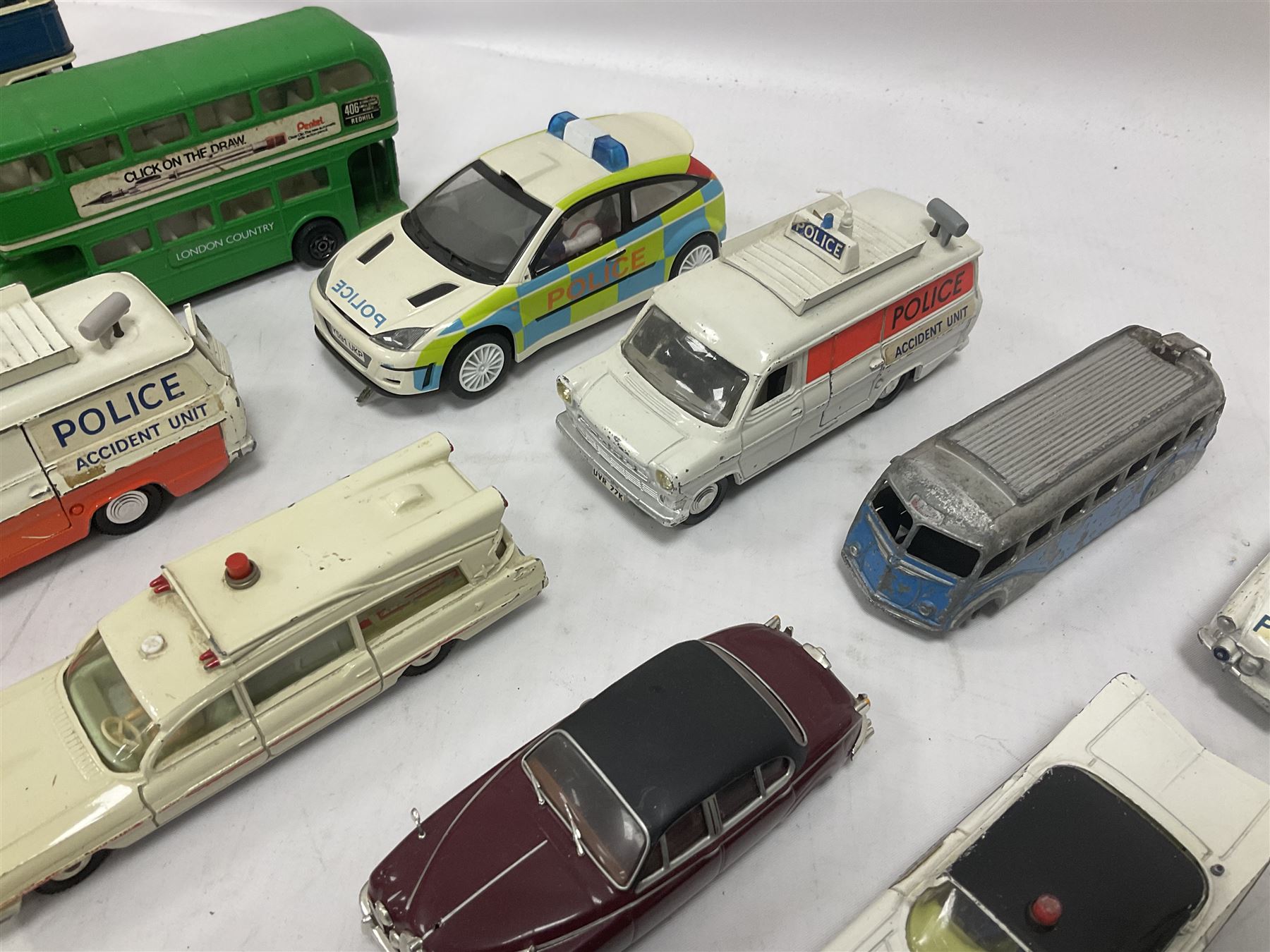 Corgi/Dinky - twenty-four unboxed and playworn die-cast models, predominantly emergency vehicles and buses; including Autocar Isobloc, Superior Criterion Ambulance, Ford Transit Police Vans, Chevrolet Impalas, Minissima, Ausin Mini Police van etc (24)