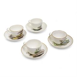 Set of four Pinxton porcelain bute shaped teacups and saucers, circa 1796-1813, pattern no. 218, painted in polychrome with landscape panels within gilt rims, possibly by John Cutts, three pieces numbered 218 beneath, saucer D14cm, teacup H6cm (8)
