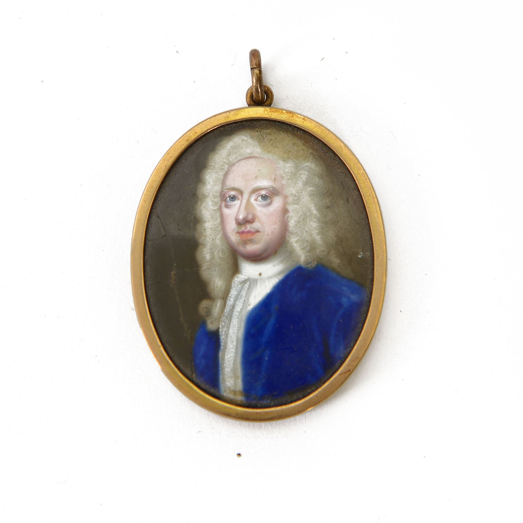 In the manner of Christian Zincke (German 1683-1767)
Portrait miniature upon enamel, circa 1750
Head and shoulder portrait of a gentleman in blue coat, possibly George II 
Within 9ct gold frame with ivory panel verso
Oval 4.5cm x 3.5cm

This item has been registered for sale under Section 10 of the APHA Ivory Act