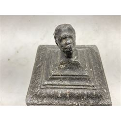 19th century lead tobacco box, the body of square form decorated with panels of courting couples in relief supporting stepped tapering lid with figural male head finial, H18.5cm