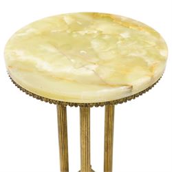 Neoclassical onyx and brass jardinière or plant stand, circular onyx top over an acanthus gilt frieze, supported by for fluted composite columns, square plinth with applied rosette mounts and stepped base, raised on scroll feet  