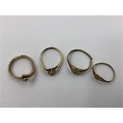 Four 9ct gold rings, to include cubic zirconia wishbone ring, single stone cubic zirconia ring and two heart design signet rings