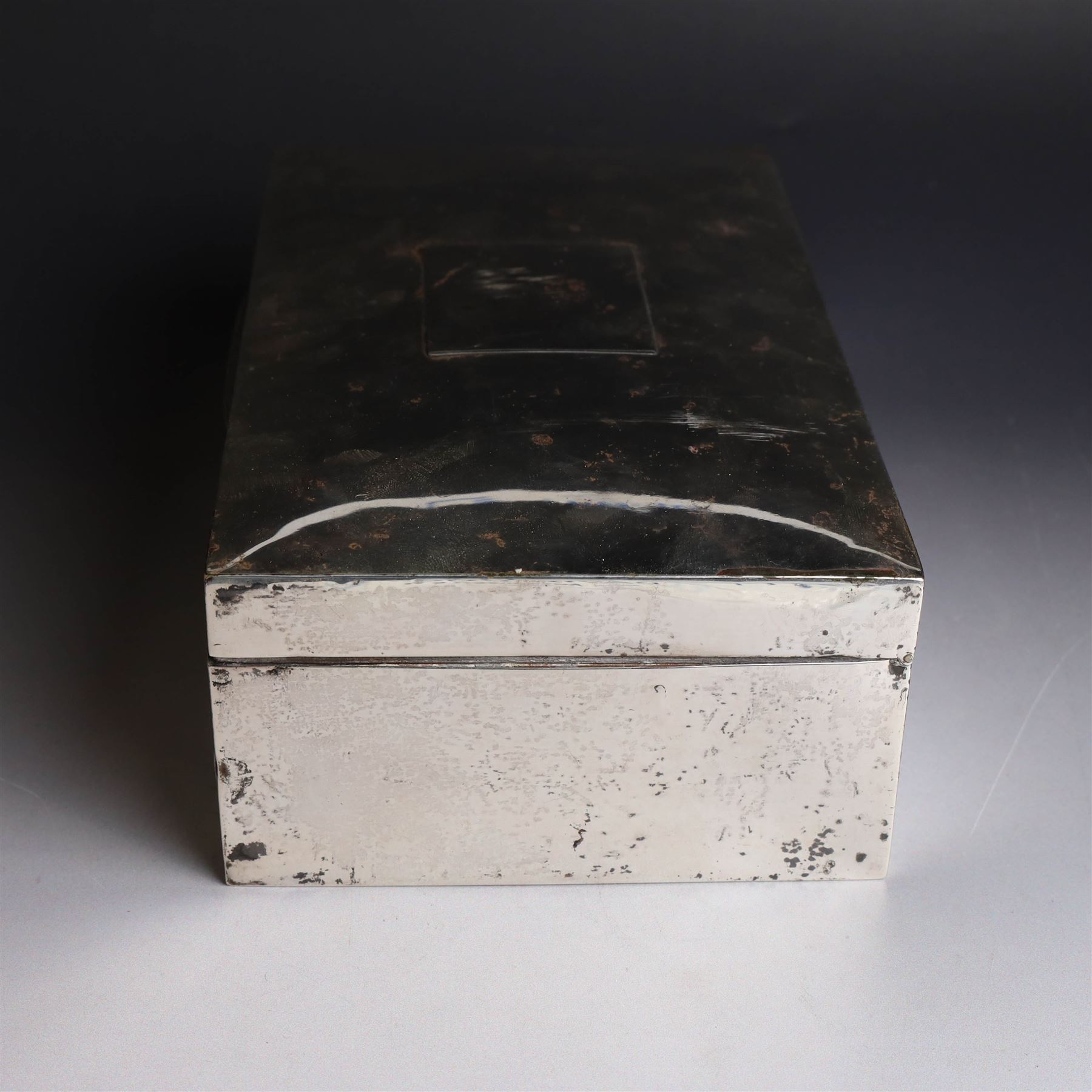 1920s silver mounted cigar box, of rectangular form with later applied vacant rectangular cartouche to hinged cover, opening to reveal compartmentalised softwood interior, hallmarked London 1923, makers mark worn and indistinct, H7cm, W22cm