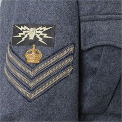 WWII Royal Air Force battle dress blouse, belonging to Flight Sargent Colin Scott 3011422, dated 1945, tailors label for M & N Horne Ltd 1945, Size No 7, blue cloth, Signaller cloth brevet, wireless officers patch to right sleeve and braid sergeant stripes to both sleeves, together with his flight log book, postings & Movements, Royal Air Force Service and Release Book, photographs etc  