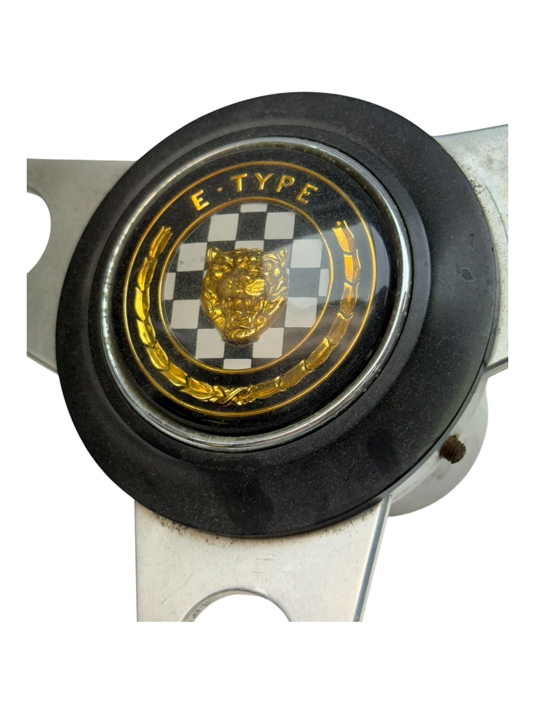 Steering wheel with E-Type Jaguar badge, AA badge, RAC badge and Lotus gearstick top