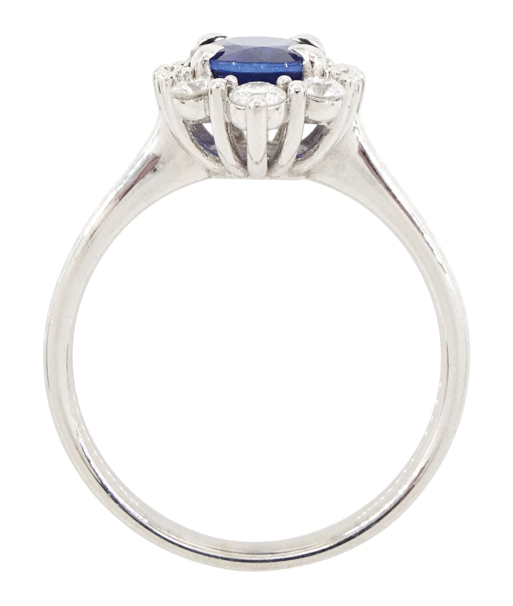 14ct white gold sapphire and diamond cluster ring, single oval cut sapphire of approx 1.00 carat, with round brilliant cut diamond surround, total diamond weight approx 0.40 carat