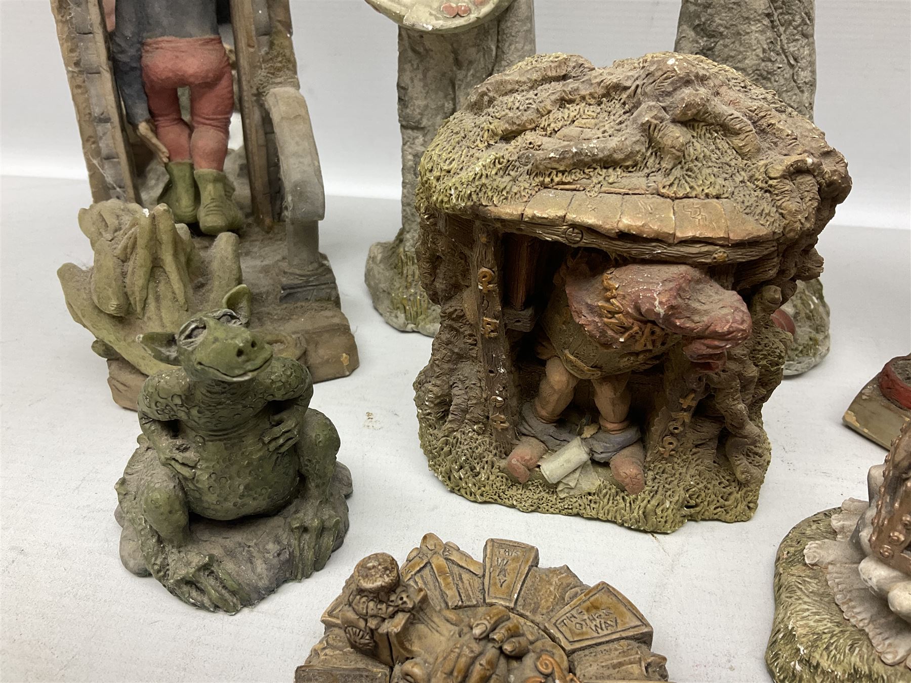 Seven Terry Pratchett Discworld figures by Clarecraft, to include The Luggage DW04M Smugli D990, pair of Home Sweet Home bookends, wall hanging modelled as a dragon upon stone plinth etc, tallest H19cm