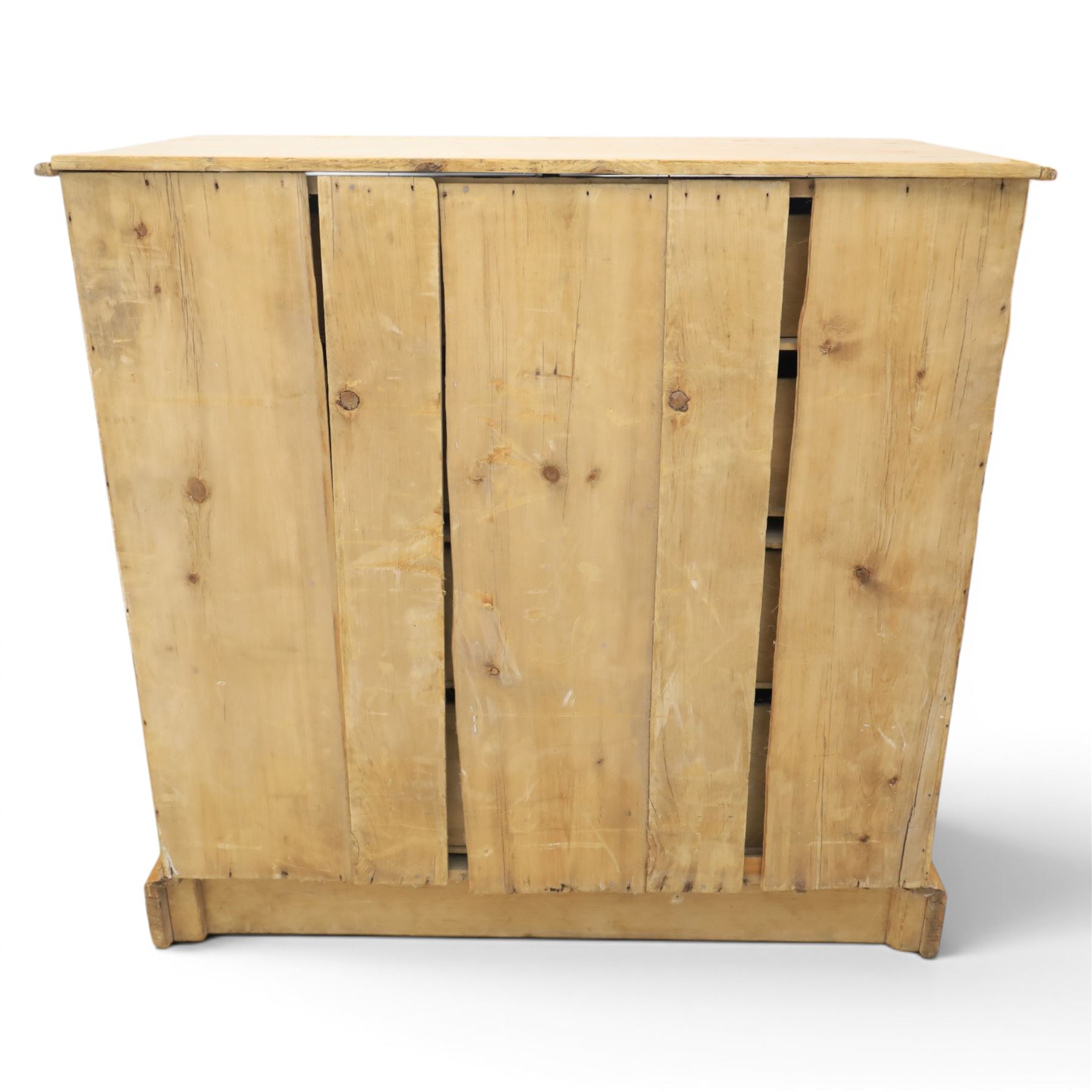 Victorian waxed pine chest, fitted with two short and three long drawers, turned wooden handles, raised on plinth base