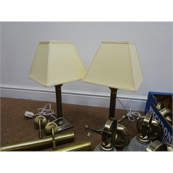  Seventeen brushed brass wall lights with scroll branch with alabaster glass shade, one without shade, two cylindrical brushed brass wall lights, and two table lamps with cream shades (22)  