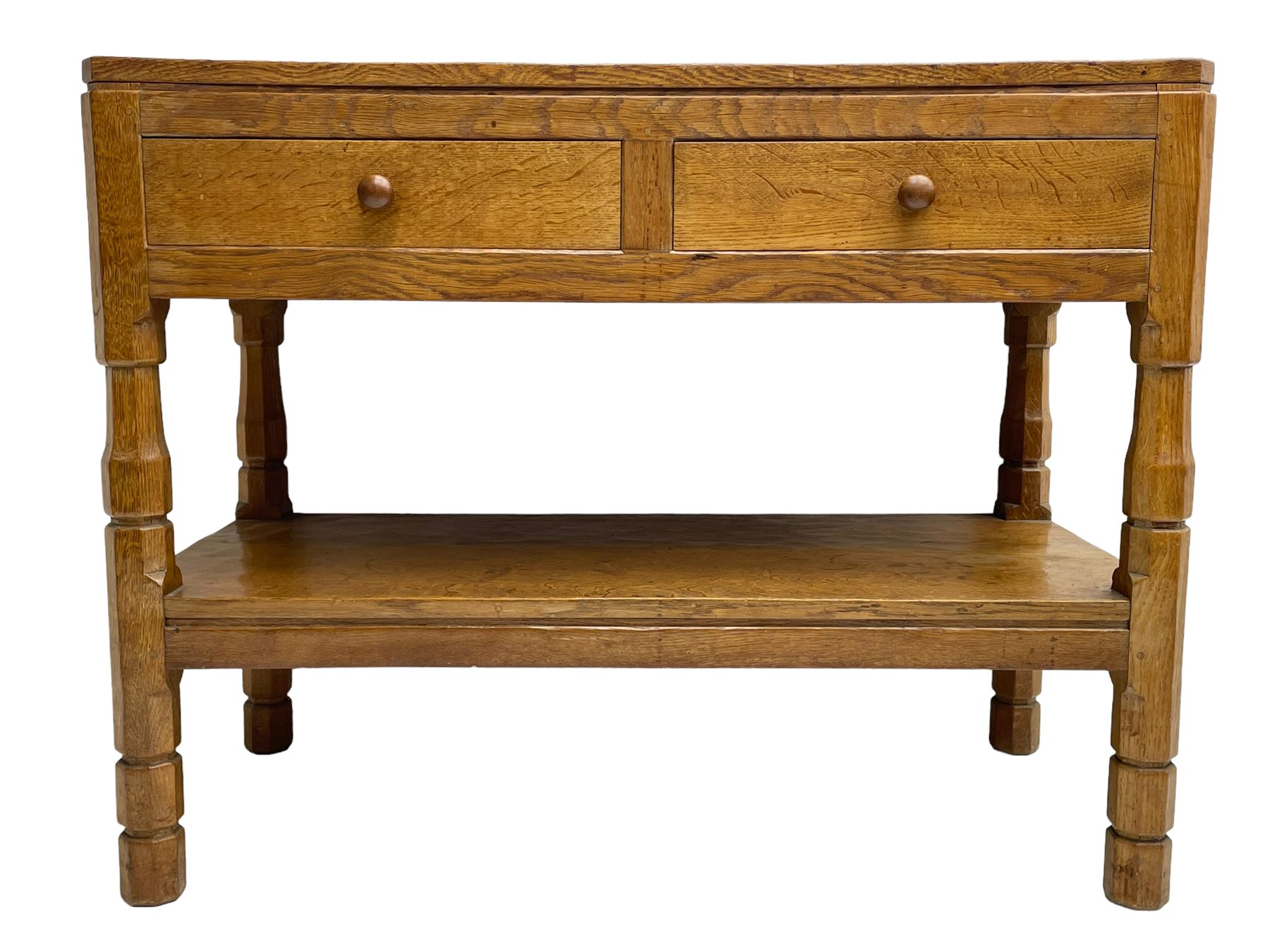 Mouseman - circa. 1950s oak serving table, adzed rectangular top over two drawers, on octagonal supports joined by adzed undertier, the rear right leg carved with mouse signature, by Robert Thompson of Kilburn