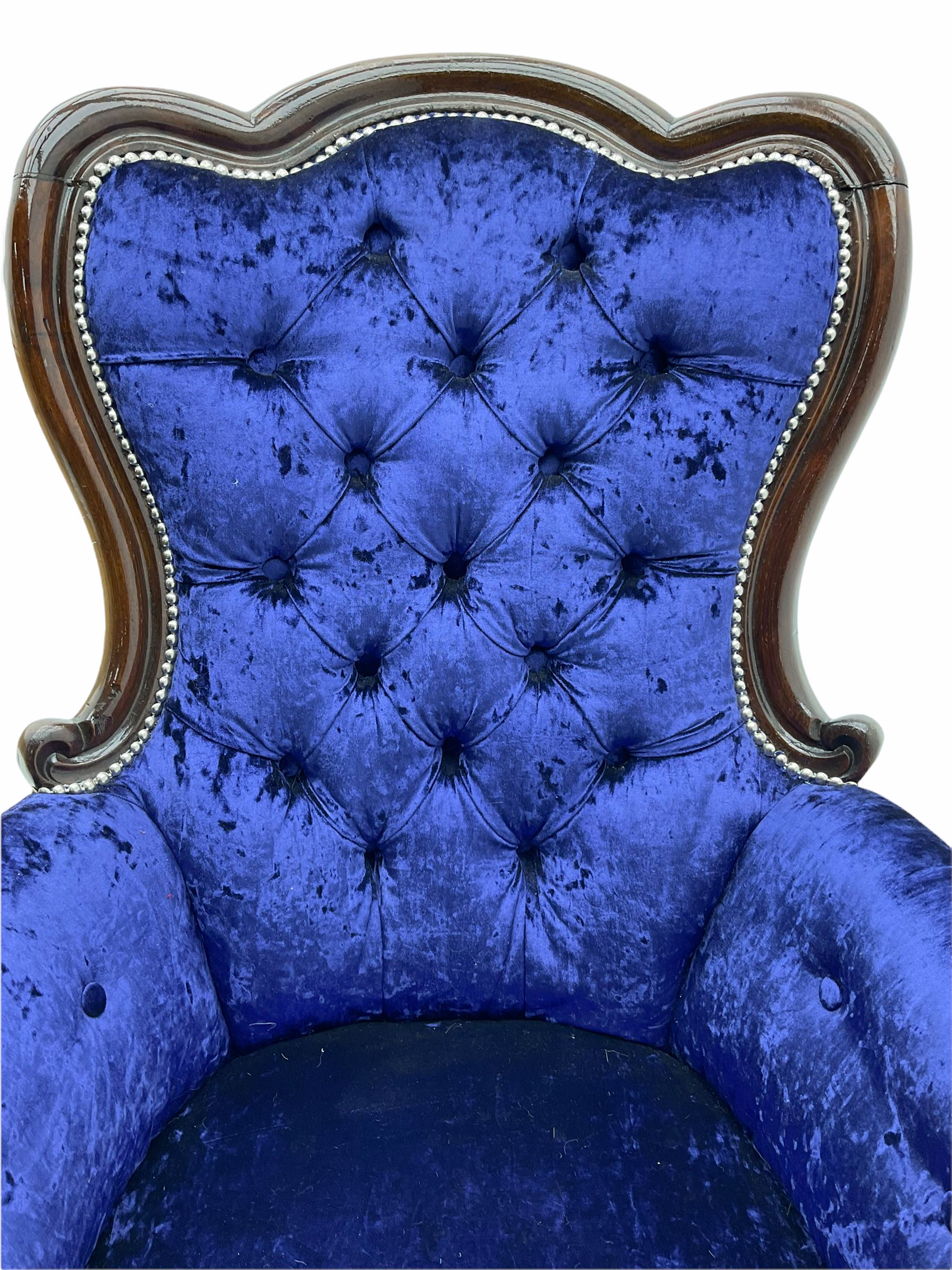 Victorian style mahogany framed armchair, upholstered in blue crushed velvet studded fabric