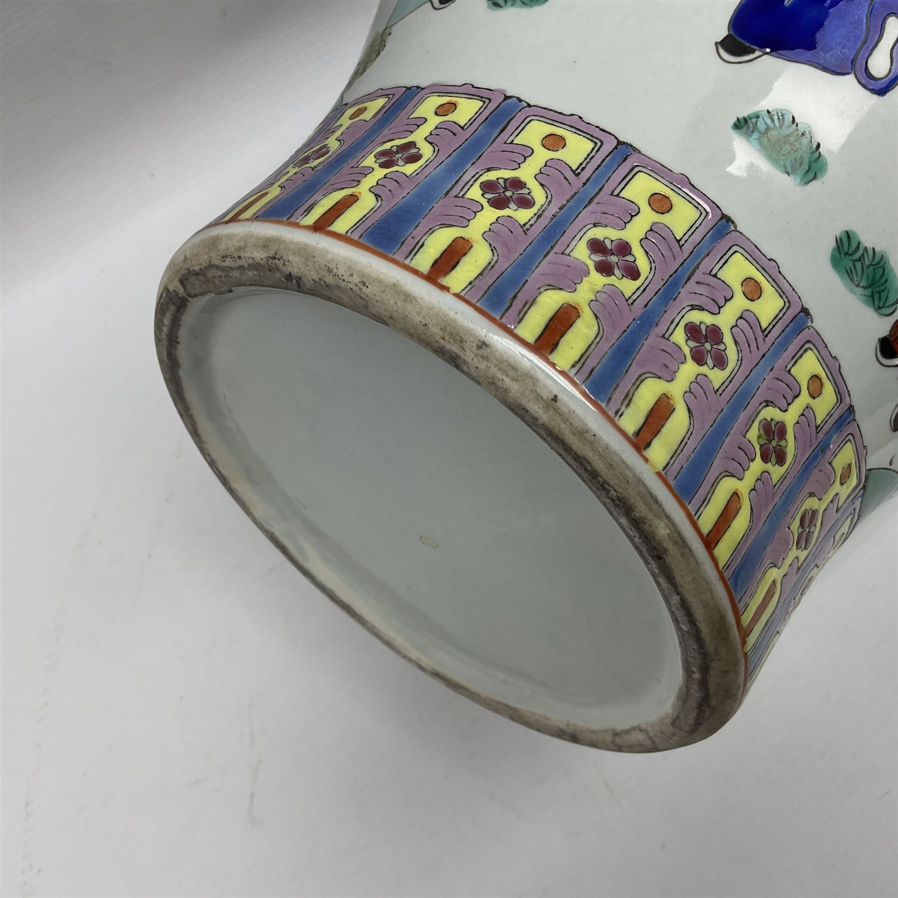 20th century Chinese Famille Rose vase, of baluster form with flared lobed rim and twin figural handles, decorated in polychrome enamel with figures dancing and playing instruments within a garden setting, H42cm