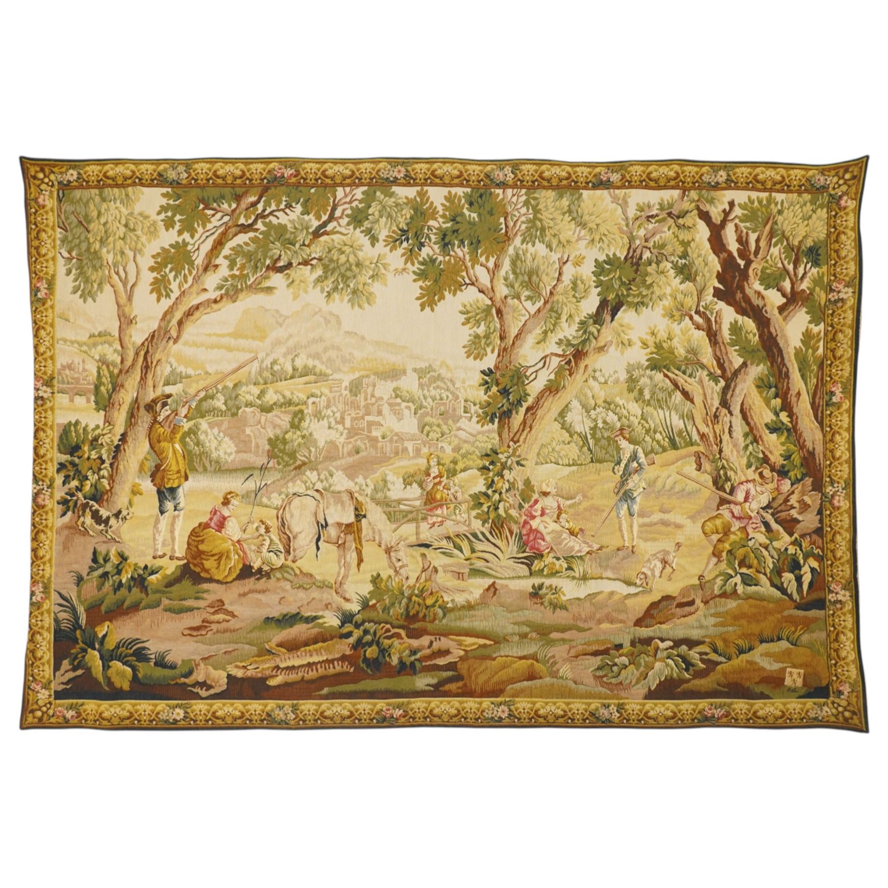Large French Aubusson style verdure tapestry, of 18th century design but later, depicting hunters resting, 133cm x 194cm