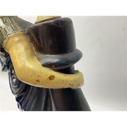 Composite table lamp modelled as a Roman Emperor donning blue robes, upon quatrefoil base modelled with rams heads and winged cherubs, H56cm excl fitting