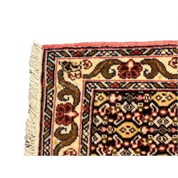 Small Persian Bidjar rug, the field decorated with floral Herati motifs, within floral design borders and guard stipes 