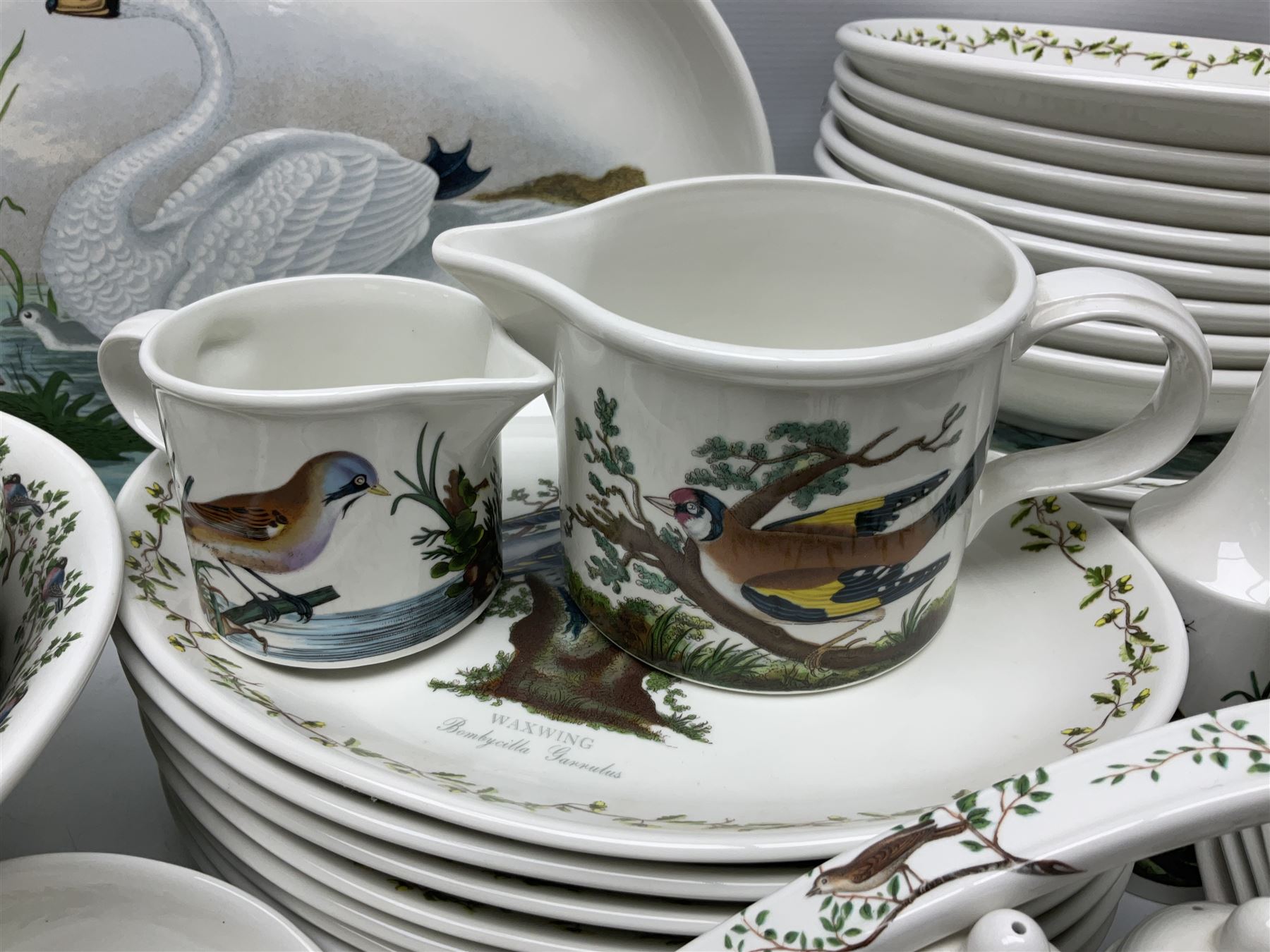 Portmeirion Birds of Britain pattern, dinner service for eight, to include covered soup tureen with ladle, dinner plates, soup bowls, side plates, oval plates, a serving platter, two oval serving dishes, salt and pepper, etc and eight shell dishes in the British fish pattern (56) 
