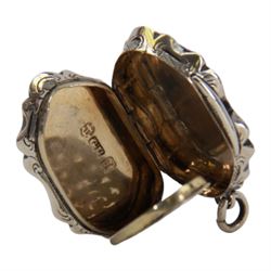 Victorian silver vinaigrette, of oval form with shaped edge, decorated throughout with engine turned bands, the hinged cover with vacant C scroll panel opening to reveal a foliate pierced grille and gilt interior, hallmarked George Unite, Birmingham 1857, L3.5cm