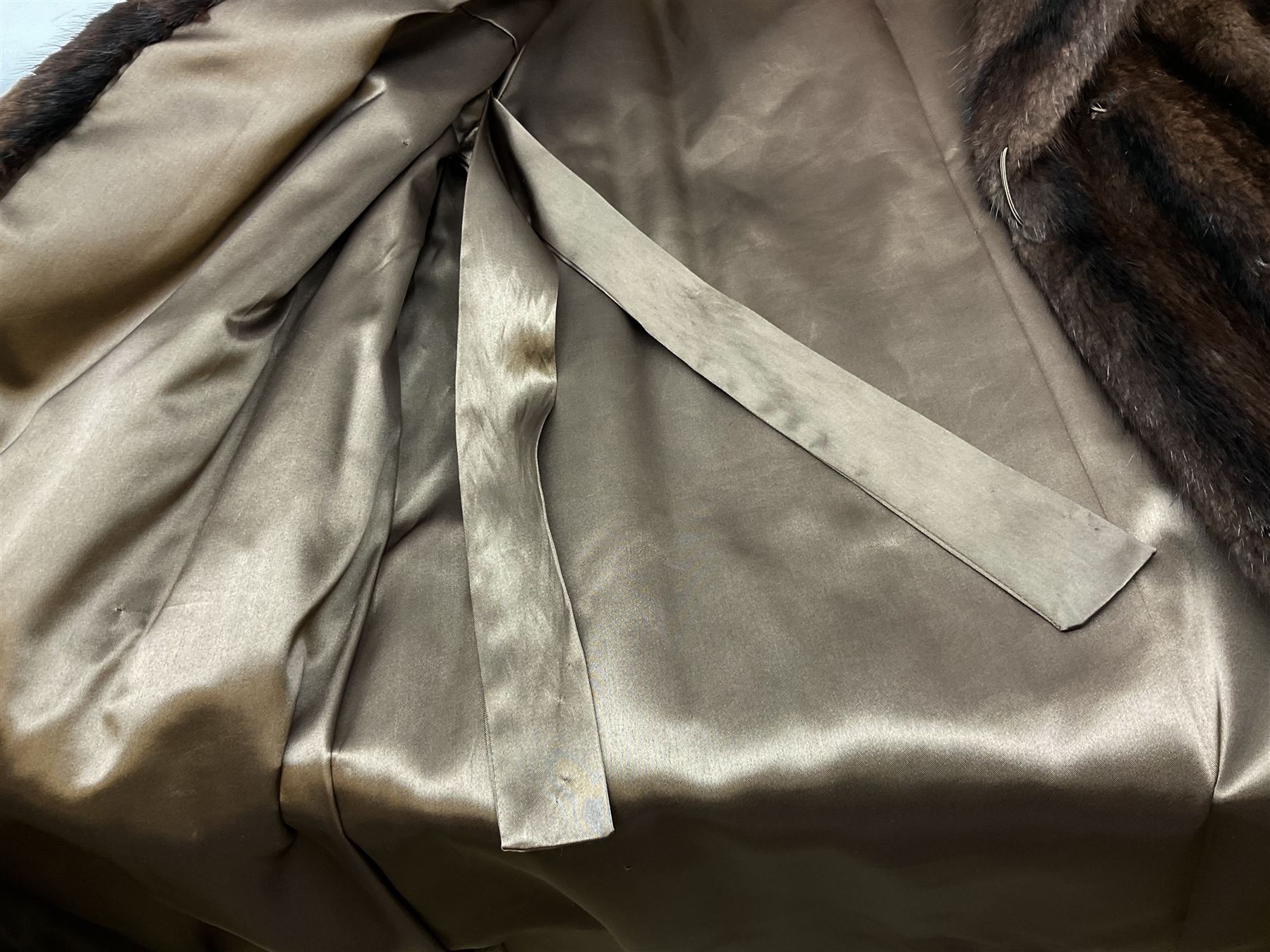 Ladies three quarter length brown mink coat, together with a ladies short black rabbit fur coat 