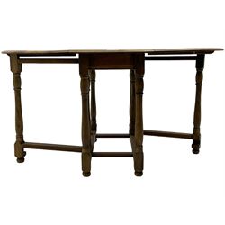 Mid-to-late 20th century oak and beech drop-leaf dining table, gate-leg action base with turned supports