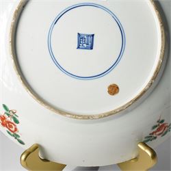 Chinese powder blue ground famille verte charger, possibly Kangxi, decorated with a central cartouche enclosing two female figures, with smaller shaped panels enclosing lions and foliage, square seal mark in blue to base, D28cm