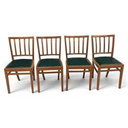 Mid 20th century teak extending dining table, together with eight teak chairs with green leather seats, extends to 154cm
