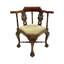 Georgian design mahogany corner chair, with pierced and carved splats, shaped and moulded seat with drop in cushion, on acanthus carved cabriole supports with ball and claw feet, joined by turned x-framed stretchers 
