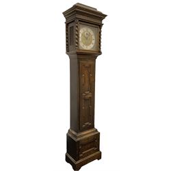 8-day oak longcase clock - in an early 18th century styled case with a caddy top, square hood door with barley twist columns, long carved trunk door on a conforming plinth with an applied skirting base, square brass dial with an engraved centre, silvered chapter and spandrels, 19th century rack striking movement, striking the hours on a bell. With weights and pendulum.