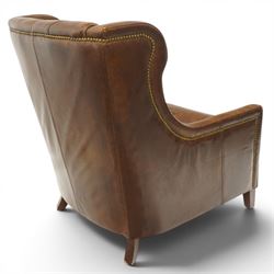 Timothy Oulton - pair of wingback armchairs upholstered in back-buttoned chocolate brown leather with loose seat cushion, raised on square tapering feet