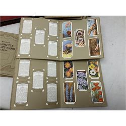 Album of Wills cigarette cards containing sets of Naval Dress & Badges, Fish & Bait, Aviation and Arms of the British Empire; twenty individual Wills albums; and large quantity of loose cigarette and trade cards