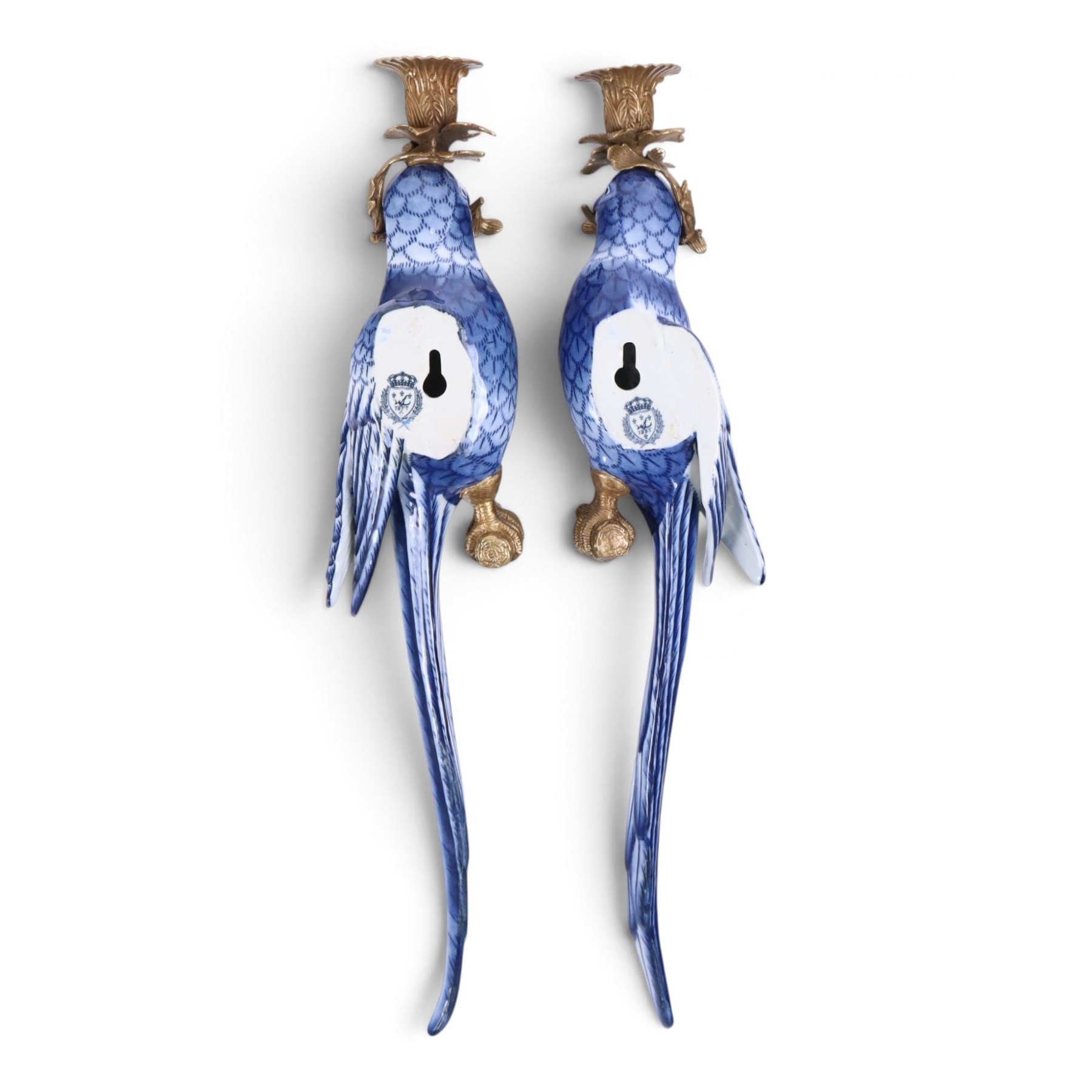 Pair of wall sconces, modelled as blue parrot upon a gilt branch, H47cm