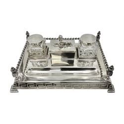 Egyptian Revival style desk stand, with pen tray and two glass inkwells, upon four bracket feet, W23cm